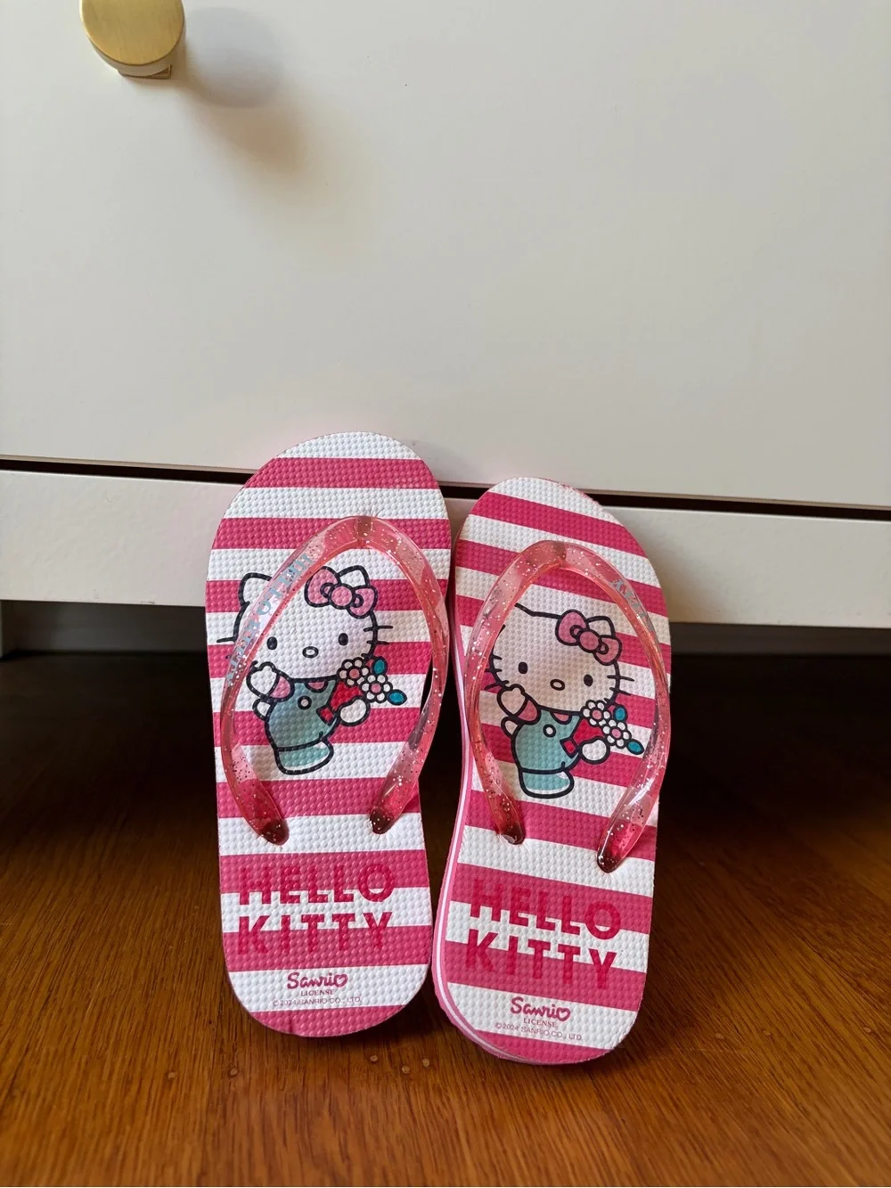 Sanrio Hello Kitty Pink and White Striped Flip Flops